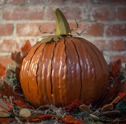 Our Orange Metal Indoor/Outdoor Pumpkin Candle Luminary is 15” tall x 14” in diameter and has a large 6” opening for you to add your own flameless candle or 3-wick jar candle and you will immediately light up any space day or night. Our steel construction pumpkins are rust-proof, powder coated, UV resistant and so great for creating indoor or outdoor beauty, season after season. Also available in white and expresso colors. 