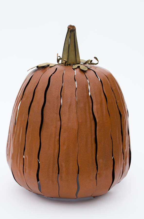  Our Orange Metal Indoor/Outdoor Pumpkin Candle Luminary is 18” tall x 12” in diameter and has a large 6” opening for you to add your own flameless candle or 3-wick jar candle and you will immediately light up any space day or night. Our steel construction pumpkins are rust-proof, powder coated, UV resistant and so great for creating indoor or outdoor beauty, season after season. Also available in white and expresso colors. 