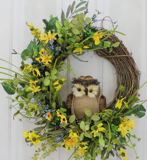 Our Owl and Yellow Flowers Grapevine and Silk Front Door Wreath is 23” in diameter and custom made here in the USA and features silk flowers in bright yellow with a touch of blue with lots of wispy greenery and, of course, the most adorable owl sitting front and center on the wreath.