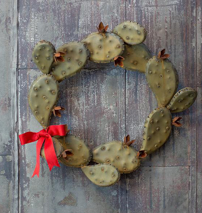 Our Prickly Pear Cactus Handcrafted Metal Front Door Wreath can be used year round. Add a bow to celebrate a special occasion. 
