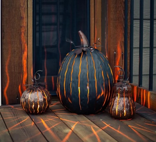 Shown with our Expresso Pumpkin Luminary. Our Pumpkin and Gourd Mini Luminary Lanterns are handcrafted from metal in a hammered finished coffee color and they are wonderful for indoor or outdoor use. They also look great scattered among our larger pumpkins as well. They can easily accommodate a flameless or tea light candle. Our pumpkin and gourd set makes for a magical statement for fall and beyond. 
