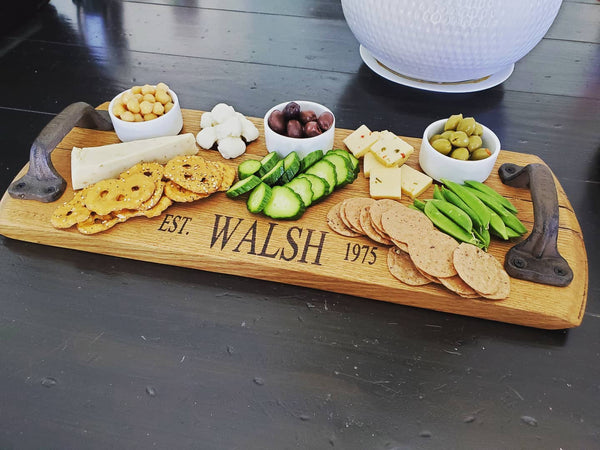Our Reclaimed Bourbon Head Cheese Tray is handcrafted in the USA from reclaimed and recycled wood bourbon head barrels and features heavy duty iron handles and can be purchased with or without your own personal message.