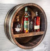 Our Reclaimed Whiskey Barrel Head Cabinet Shelf is made from retired whiskey barrels that have been distinctively repurposed into whiskey barrel head wall décor that has a rustic, vintage style that is unique and purposeful. The shelf portion can be personalized with your own creativity or you can use one of our 3 premade sayings. This custom made to order item ships in 2-3 weeks. It is 21” in diameter by 7” deep.  Shown with personal engraving of our choice.