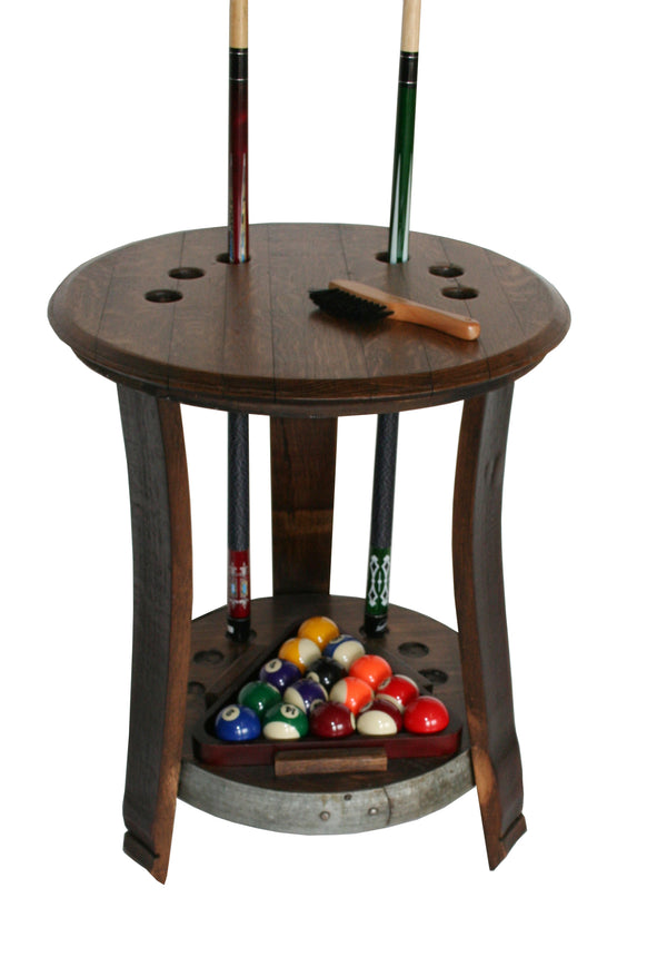 Our Reclaimed Wine Barrel Head Pool Cue Rack Table is custom made to order here in the USA and is 27” tall x 23” in diameter. Not only will it give you a beautiful piece of furniture, it will securely hold your cue sticks, up to 6 of them, as well as your billiards and rack.  It is available in 4 color stain choices, caramel, pine, weathered or noir.