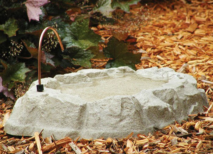 Our River Rock Bird Bath with Water Dripper can sit on the ground to attract birds to a water supply
