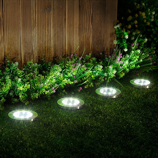 Our Round In Ground Solar Disk Landscape Lighting comes as a set of 4 disks that will accent any outdoor space and they will illuminate the night into an array of spectacular beauty… place them up a walkway, added within your flowers or up your driveway. So easy to install… simply turn on the switch under the cap and push the stake into the soil and the solar disk lights will automatically turn on in darkness and turn off in daytime or in bright areas. Each Size is 4.61” x 4.84” 
