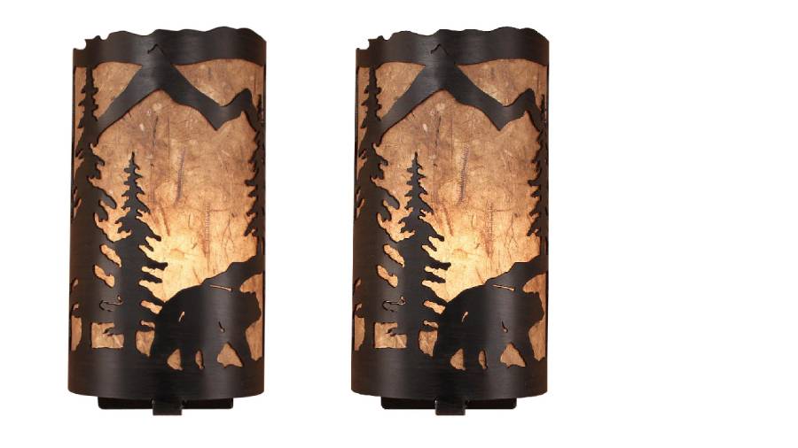 Our Rustic Bear Panel Wall Sconce (set of 2) captures the forested beauty with cutouts of a metal bear and trees in front of the amber parchment paper shade