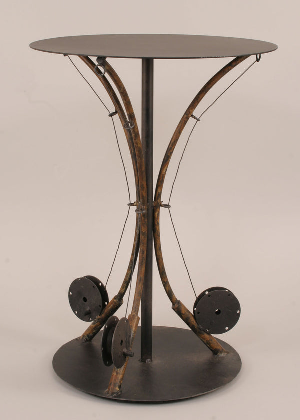 Shown with a background color, our Rustic Fly Fishing Pole Metal Accent Table features 3 fishing rods with reels holding up the table top and an expressive piece for rustic cabin or home