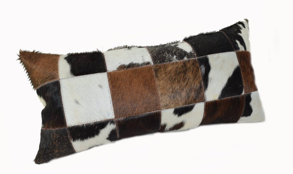 Our Tri Color Cowhide Patchwork Lumbar Pillow is 20” long x 12” tall and features an assortment of black, brown, white, tan and probably some speckled colors of cowhide too… all patchworked together to make a decorative pillow.
