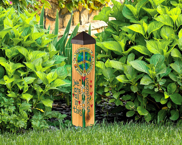 Our We Are All in This Together Decorative Obelisk Garden Yard Art Post is made in the USA and features an ultra-durable, maintenance free PVC post that has been wrapped with one of our bright automobile grade, all weather, vinyl artwork pieces to create a yard art sculpture that creates the ultimate WOW factor. Each colorful piece has a message that is inspiring and fun and will be so well loved in your garden. Size is 20” tall x 4” square.