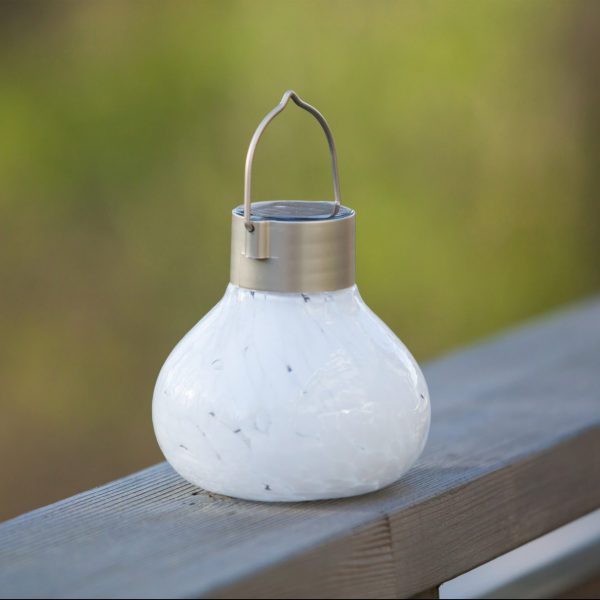Our White  Hand Blown Glass Solar Tea Lantern is 5.5″ tall x 4.5″ wide and has been crafted by skilled artisans using hand blown glass techniques that create such eye catching detail 