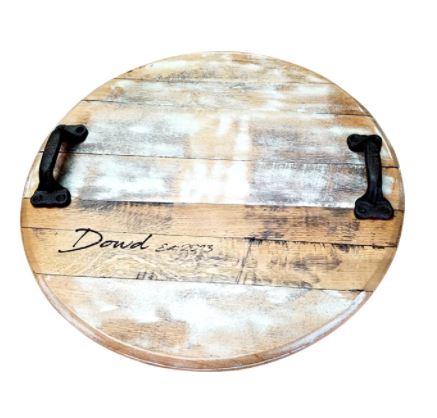 Shown, our distressed white Bourbon Barrel Head Lazy Susan with handles, has been custom engraved with our customer’s own message. Each piece is custom made to order, 21” in diameter, and are customizable with or without handles in you’re your choice of script options text of blessed - bon appetit - charcuterie - do small things with great love - gather - grateful - thankful - this is us, or, get extra creative and create your own script option.