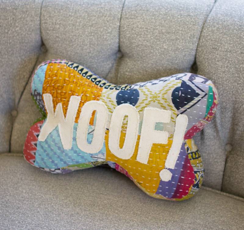 Add color and style to your home with our handcrafted to perfection, Woof, Bone Shaped Patchwork Word Lumbar Pillow