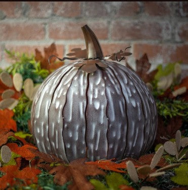 Our White Mocha Metal Indoor/Outdoor Pumpkin Candle Luminary is 15” tall x 14” in diameter and has a large 6” opening for you to add your own flameless candle or 3-wick jar candle and you will immediately light up any space day or night. Our steel construction pumpkins are rust-proof, powder coated, UV resistant and so great for creating indoor or outdoor beauty, season after season. Also available in white and orange colors. 